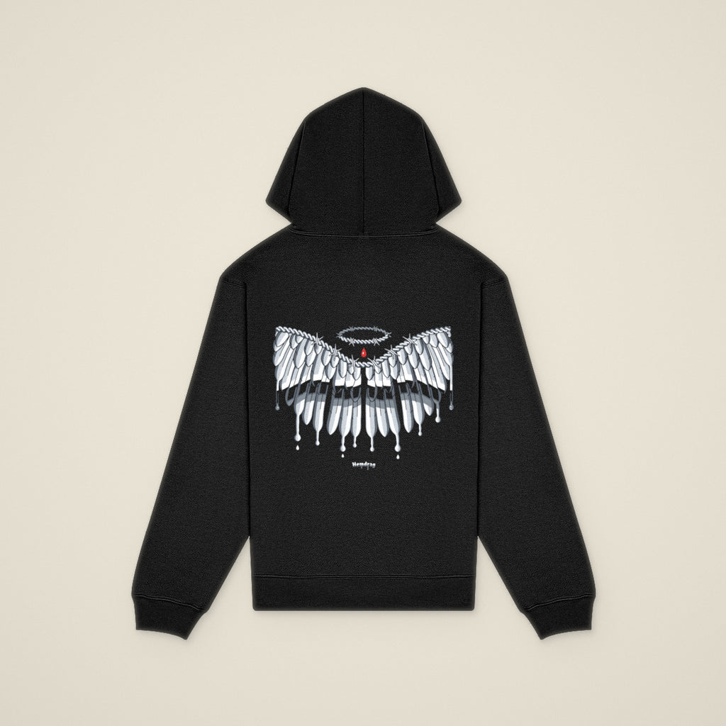 Digital preview: the No Wings Needed hoodie laid flat, back view, with the chrome wings across the back and Hemdrag below. Shown on a flat photo of a similar black hoodie used as a stand-in.